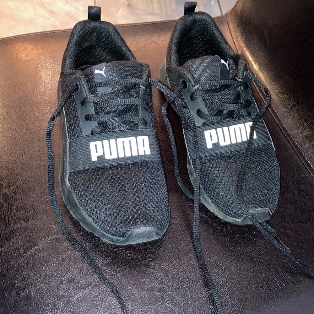 Kids size 3 puma sneakers black with white puma writing